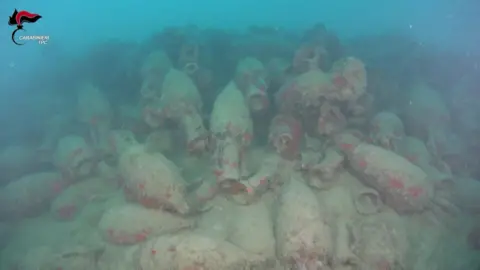 Hundreds of barnacle-covered amphorae from the ancient Roman shipwreck off Sicily